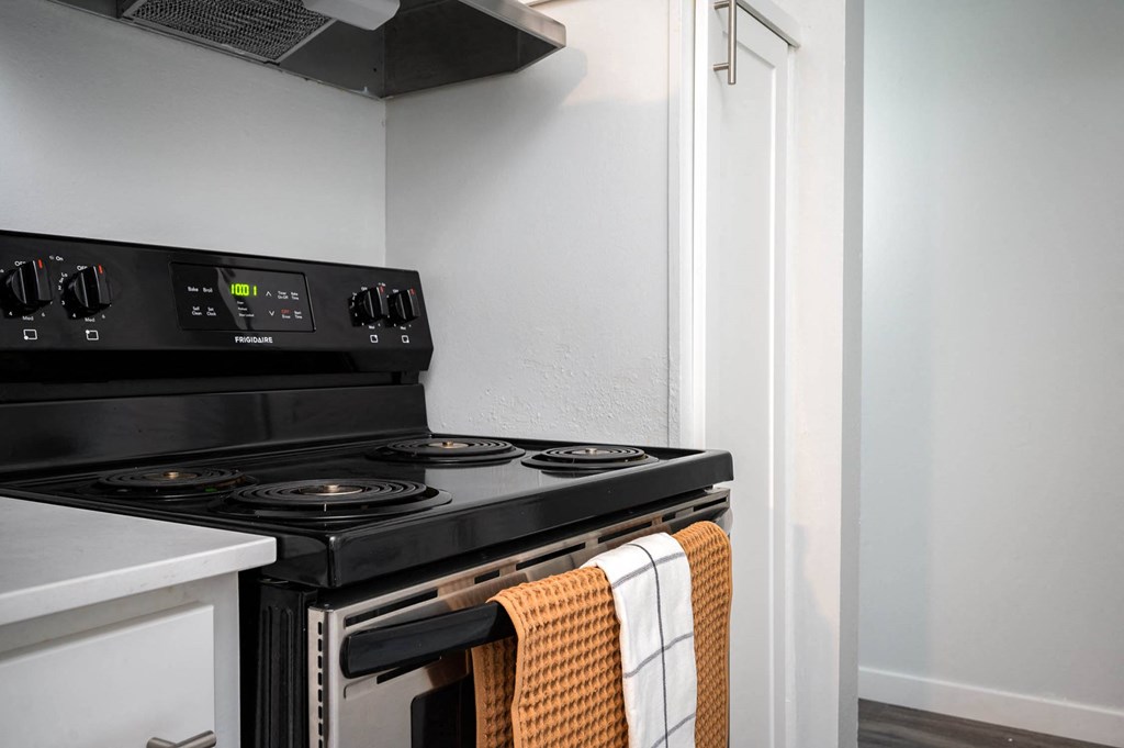 a kitchen with a stove and a microwave
